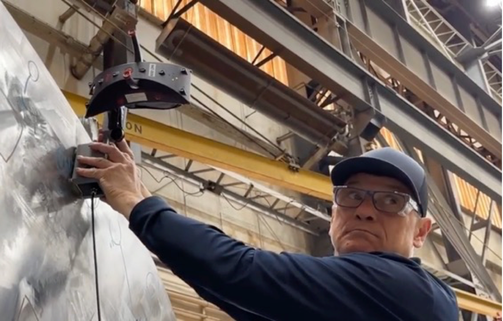 Field Inspection Scan for Industrial Asset Digital Twin Inspector scanning large industrial structure using handheld probe for digital twin inspection