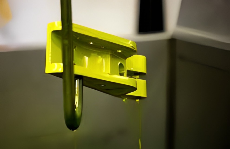 Florescent penetrant dye dripping off and aircraft component