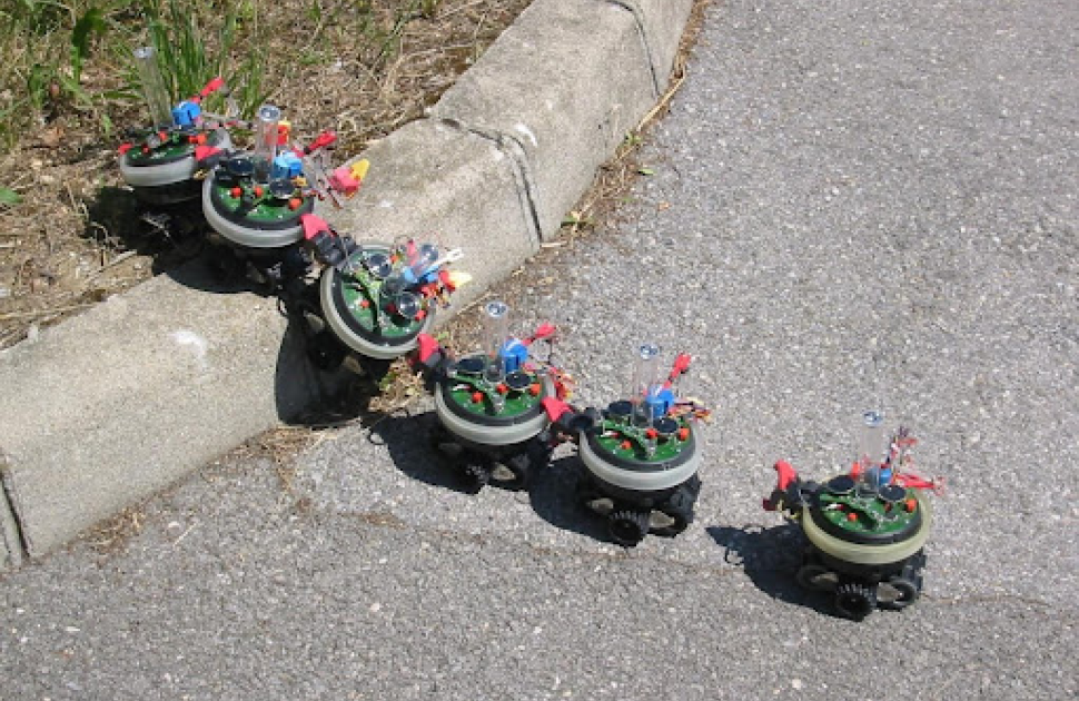 The S-bot mobile robot developed at the LIS (Laboratory of Intelligent Systems) in the Swarmbot configuration