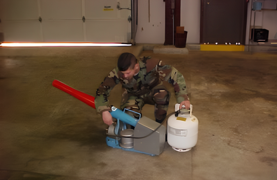 Military personnel performing VI on BASH equipment